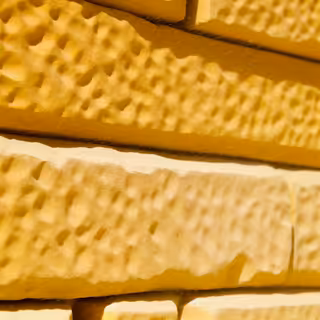 Hand-Carved Sandstone Brick Wall Texture